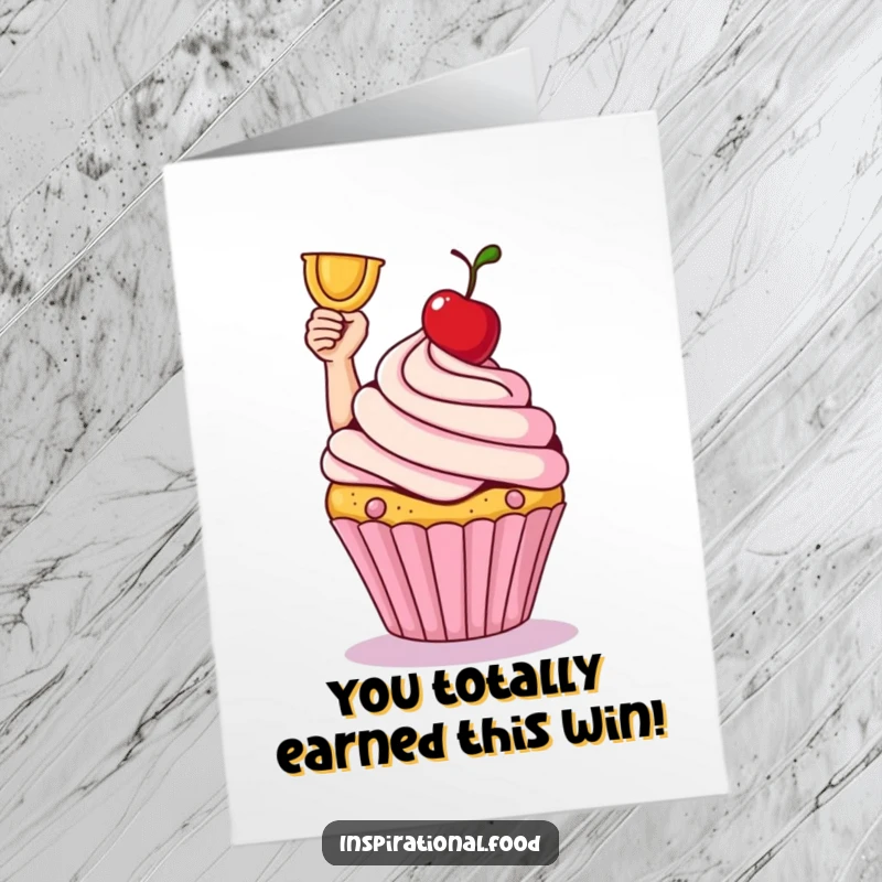 Funny Free Printable Congratulations Card: A smiling cupcake celebrates victory, raising its cherry trophy high.